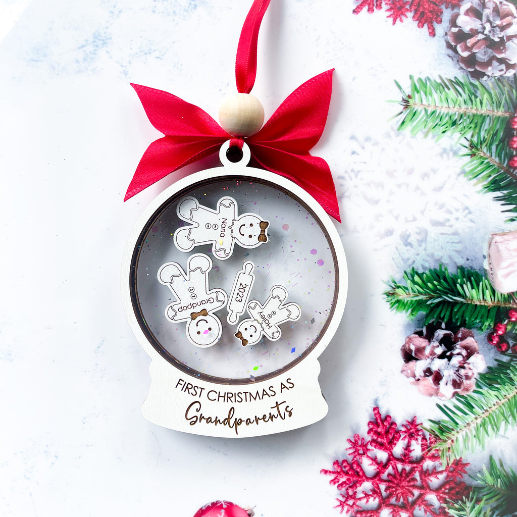 Celebrate the joy of becoming new grandparents with our exquisite "First Christmas As Grandparents" ornament. Handcrafted with love and attention to detail, this adorable keepsake is made with a high-quality laser engraved gingerbread design. 