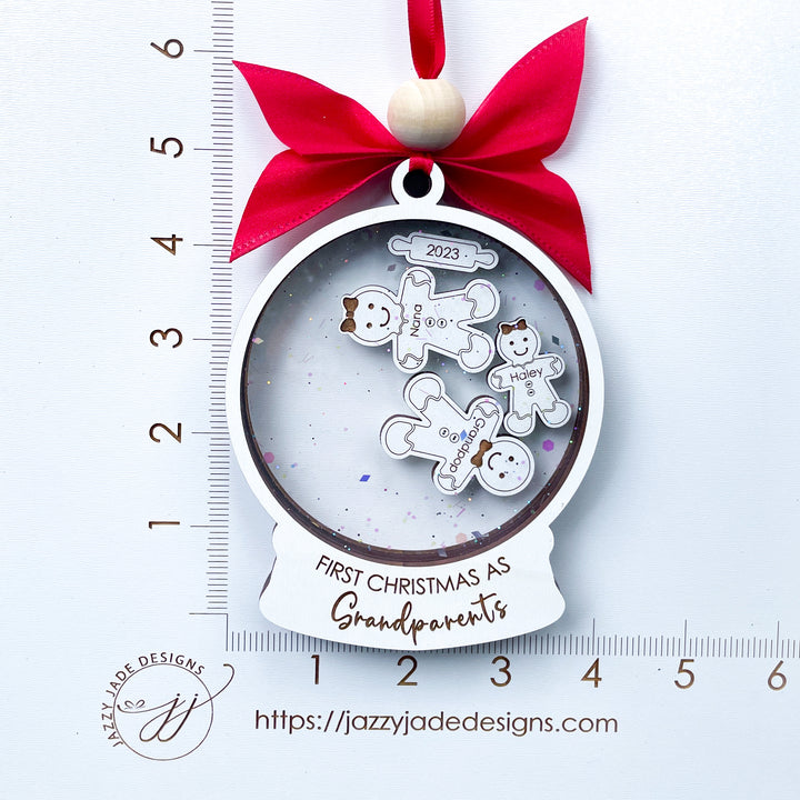 Celebrate the joy of becoming new grandparents with our exquisite "First Christmas As Grandparents" ornament. Handcrafted with love and attention to detail, this adorable keepsake is made with a high-quality laser engraved gingerbread design. 