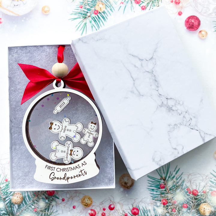 Celebrate the joy of becoming new grandparents with our exquisite "First Christmas As Grandparents" ornament. Handcrafted with love and attention to detail, this adorable keepsake is made with a high-quality laser engraved gingerbread design. 