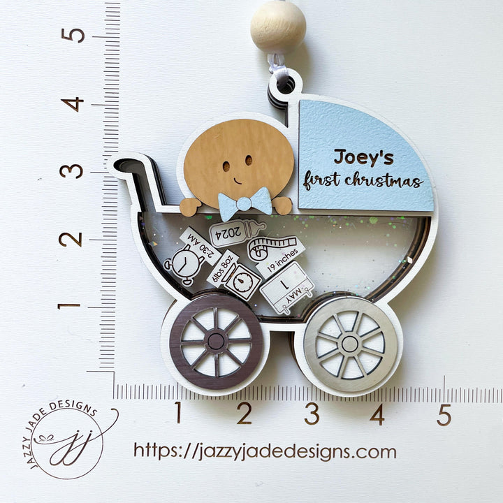 Baby boy first Christmas ornament in carriage design, personalized with name and birth details with dimensions