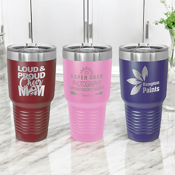 Three custom 30oz insulated stainless steel tumblers with slider lids displayed on a marble countertop.  Perfect for corporate branding, promotional gifts, or personalized drinkware.