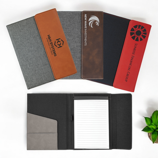 Custom laser-engraved leatherette and gray canvas portfolio with 50-page lined notepad, magnetic closure, and engraving areas for corporate branding or personalized gifts.