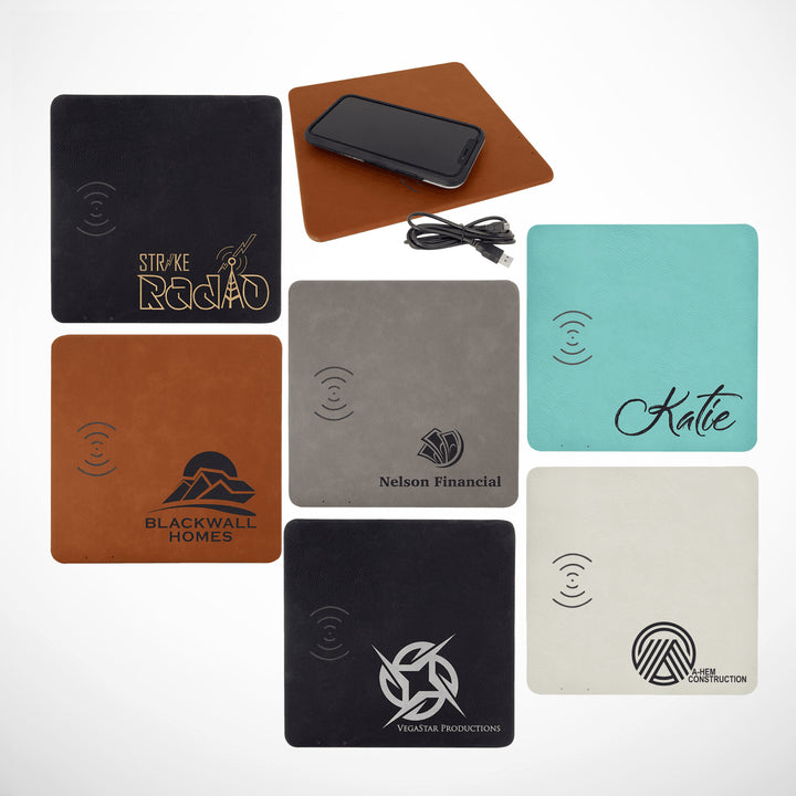 Custom laser-engraved leatherette phone charging mats in multiple colors, featuring wireless charging capability and personalized designs for corporate branding or gifts.