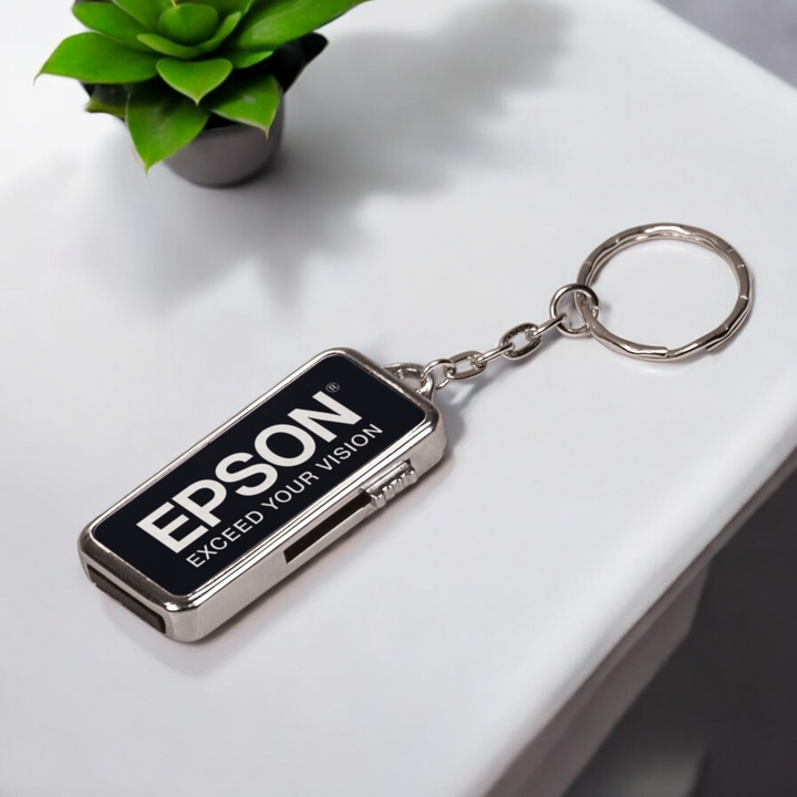 Custom 8GB metal USB flash drive with keychain, laser engraved for corporate branding and promotional products in sleek black and silver design.