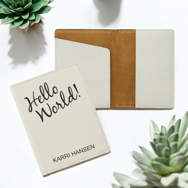 Custom laser-engraved white leatherette passport holder with card slots with custom design, perfect for personalized travel gifts and corporate branding.