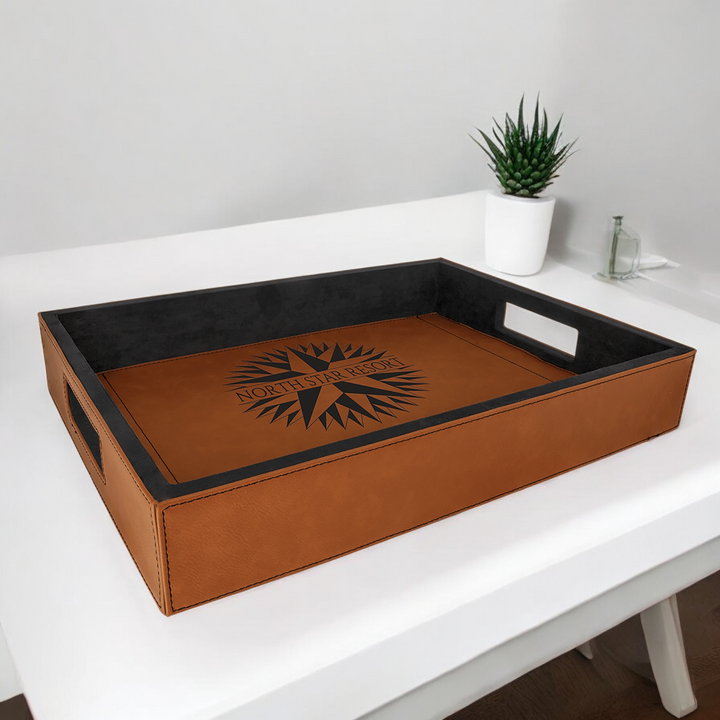 Custom 16" x 12" Laserable Leatherette Serving Tray engraved with corporate logo, featuring a sleek suede-like brown finish and cutout handles for easy carrying. Perfect for serving or decorative use.