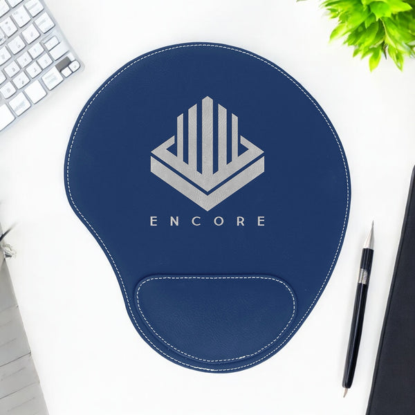 Custom laser engraved leatherette mouse pad with wrist rest in navy blue, featuring the corporate logo. Made from water-resistant, durable synthetic leatherette material, perfect for corporate branding, personalized desk accessories, or promotional gifts. Elegant design with a leather-like texture, available in 16 colors.