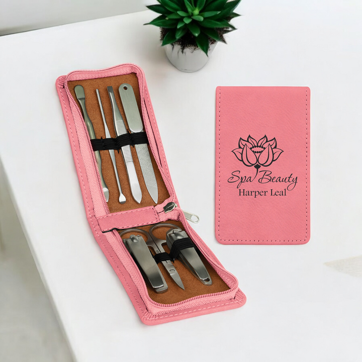 Pink 7-Piece Laserable Leatherette Manicure Gift Set with personalized engraving, zippered case, and tools including clippers, tweezers, scissors, and file. Perfect for spa gifts, travel accessories, or corporate giveaways.