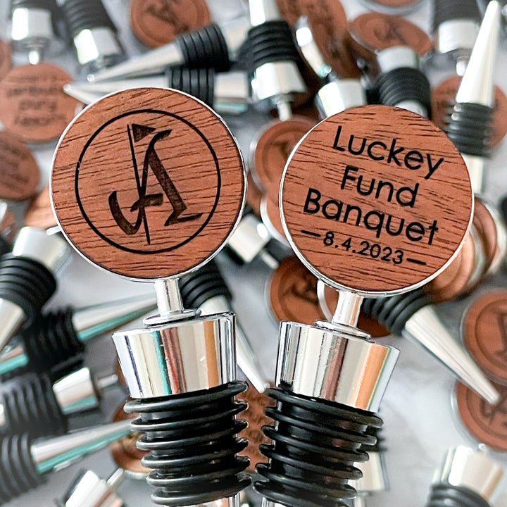 Custom wood wine bottle stoppers engraved with corporate logo, perfect for corporate events, branded gifts, and promotional giveaways.