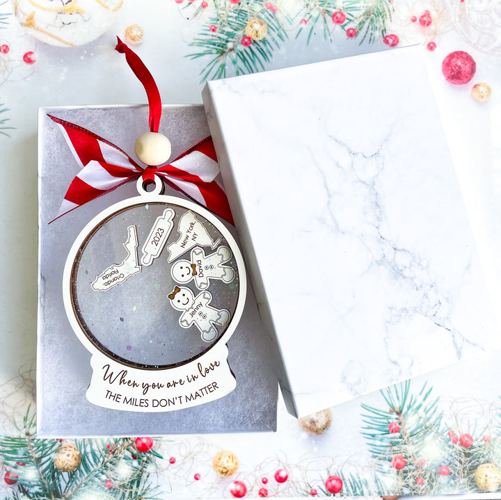 Custom long-distance friendship ornament with two states and gingerbread couple design, engraved with “When You Are in Love The Miles Don’t Matter,” perfect sentimental Christmas keepsake.
