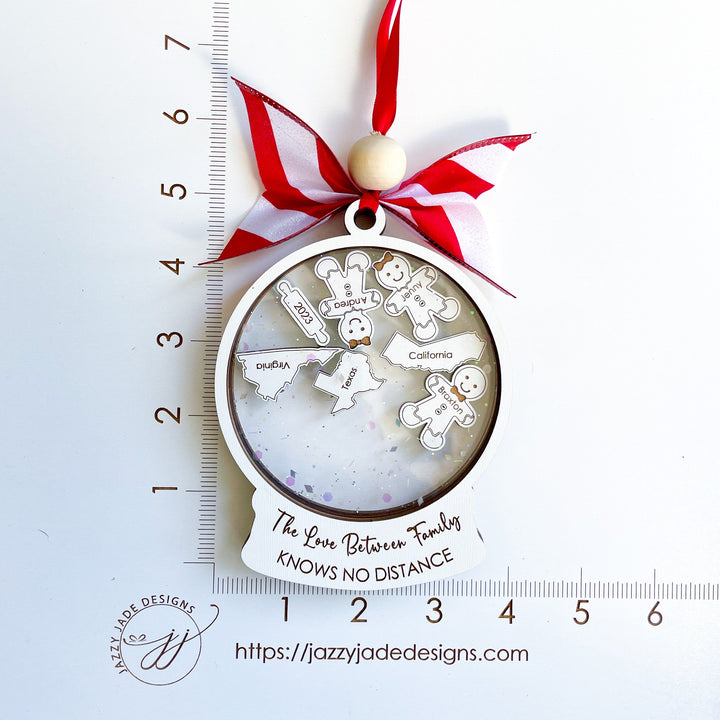 Custom Christmas ornament engraved with “The love between family knows no distance,” perfect sentimental holiday gift for siblings or parents living apart.