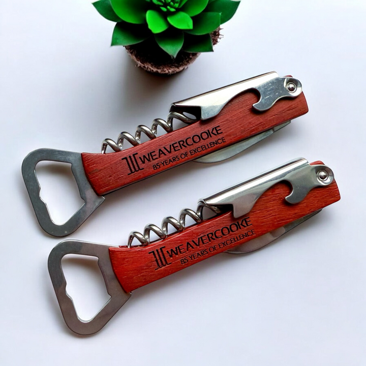 Custom engraved wooden bottle opener and wine corkscrew with stainless steel tools, featuring a sleek wooden handle personalized with a corporate logo. Ideal for branding, corporate gifts, and special occasions.