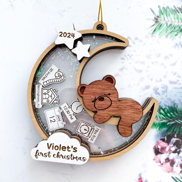 Personalized Baby’s First Christmas Ornament 2024 – Custom moon and teddy bear design with baby’s name and birth stats, including date, weight, and location, perfect for a newborn keepsake.