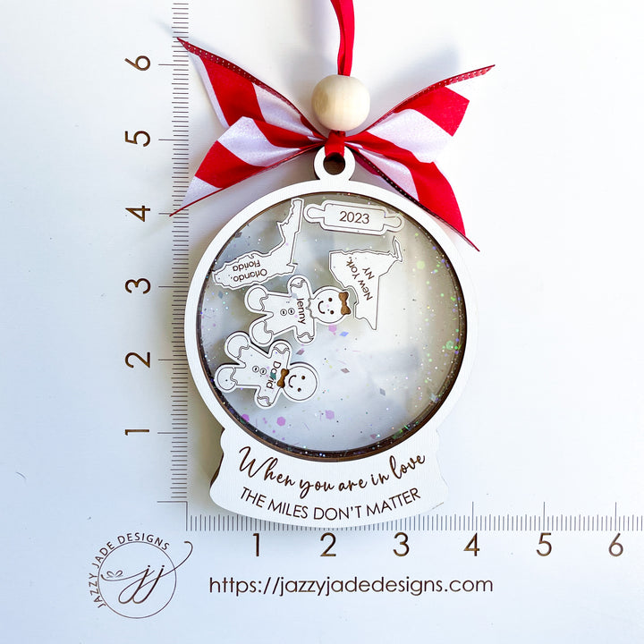 Personalized long-distance ornament for couple, featuring map and heart design with “The Miles Don’t Matter” phrase, perfect Christmas gift for loved ones apart.