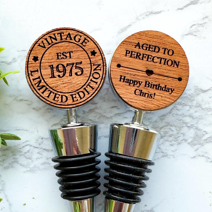 Custom wooden wine stoppers designed for a 50th birthday.  Vintage Limited Edition EST 1975 design.  Ideal for milestone birthday celebrations and unique personalized gifts for wine lovers.