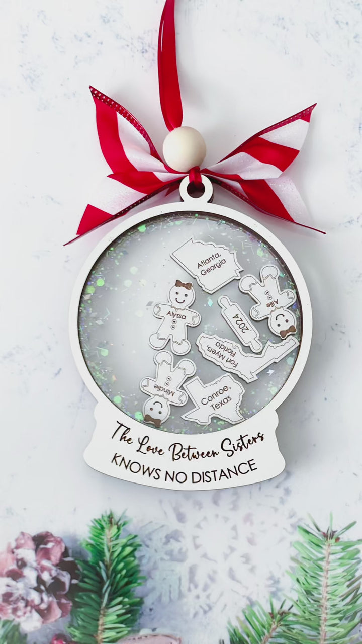 Video showcasing personalized long distance sister ornament – Custom ornament with state outlines and sister names, perfect for celebrating sisterhood across the miles.