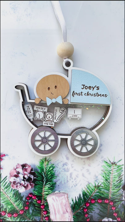 Video of Newborn baby’s first Christmas keepsake ornament with personalized name, date, and birth details.