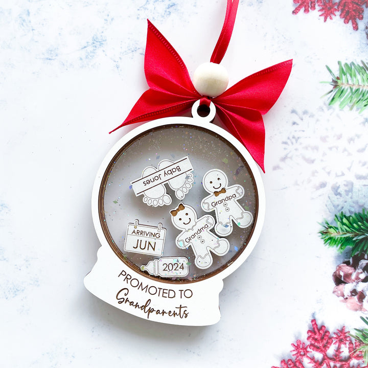 Personalized “Promoted to Grandparents” Christmas ornament, cute baby announcement keepsake for new grandparents celebrating their exciting news.