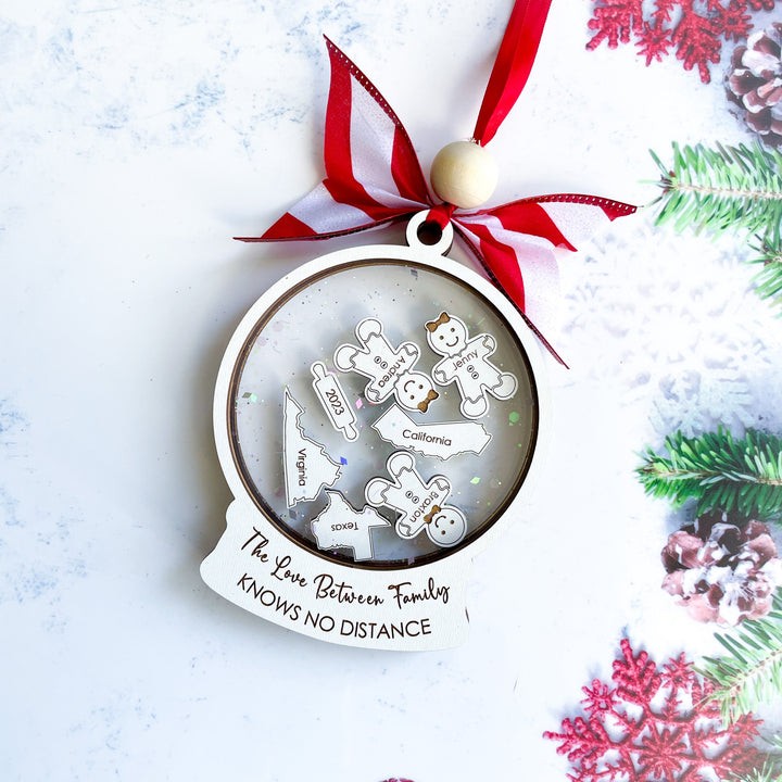 Personalized long-distance family ornament with engraved map design and quote “The love between family knows no distance,” meaningful gift for loved ones far away.