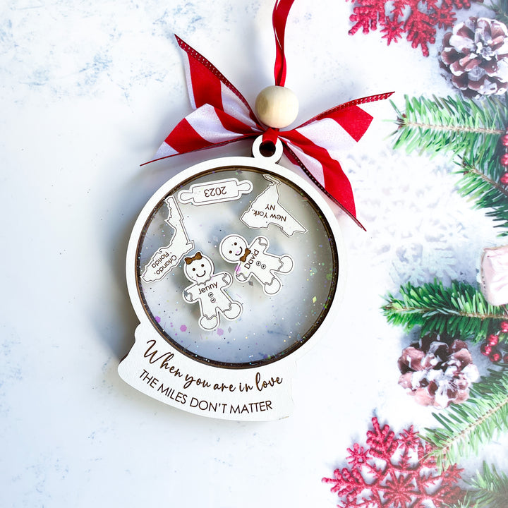 Personalized Love Between Friends ornament with quote “When You Are in Love The Miles Don’t Matter,” featuring custom long-distance states and names, unique Christmas gift for best friends.
