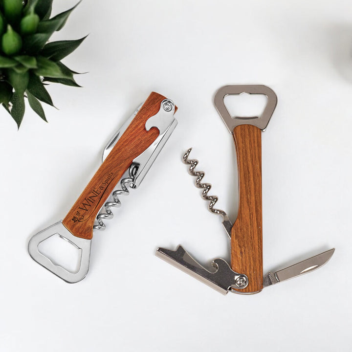 Wooden bottle opener and corkscrew multi-tool with stainless steel components, displayed in both folded and open positions. Features a personalized wooden handle, ideal for corporate branding and gifting.