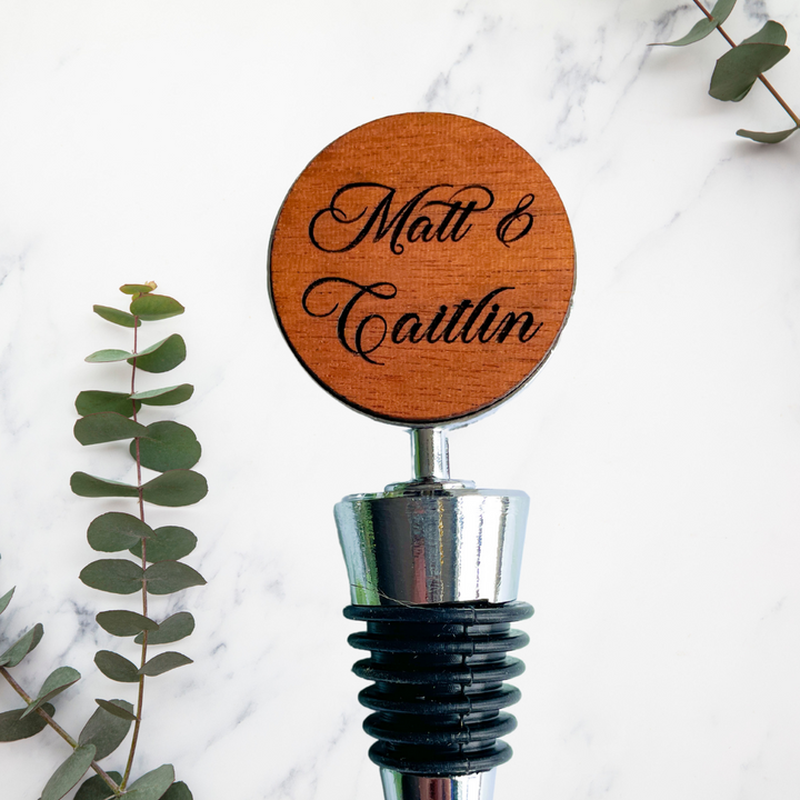 Custom first names personalized wine stoppers engraved for couples celebrating weddings anniversaries or engagements handcrafted luxury barware accessory elegant wine lover gift and keepsake perfect for romantic occasions and stylish personalized home decor displays